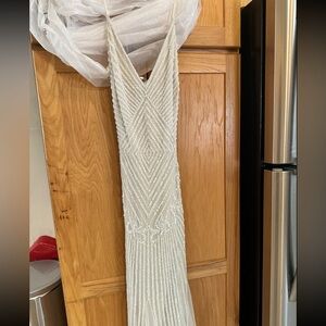 Brand new wedding dress. Never worn. Tags still on dress.
